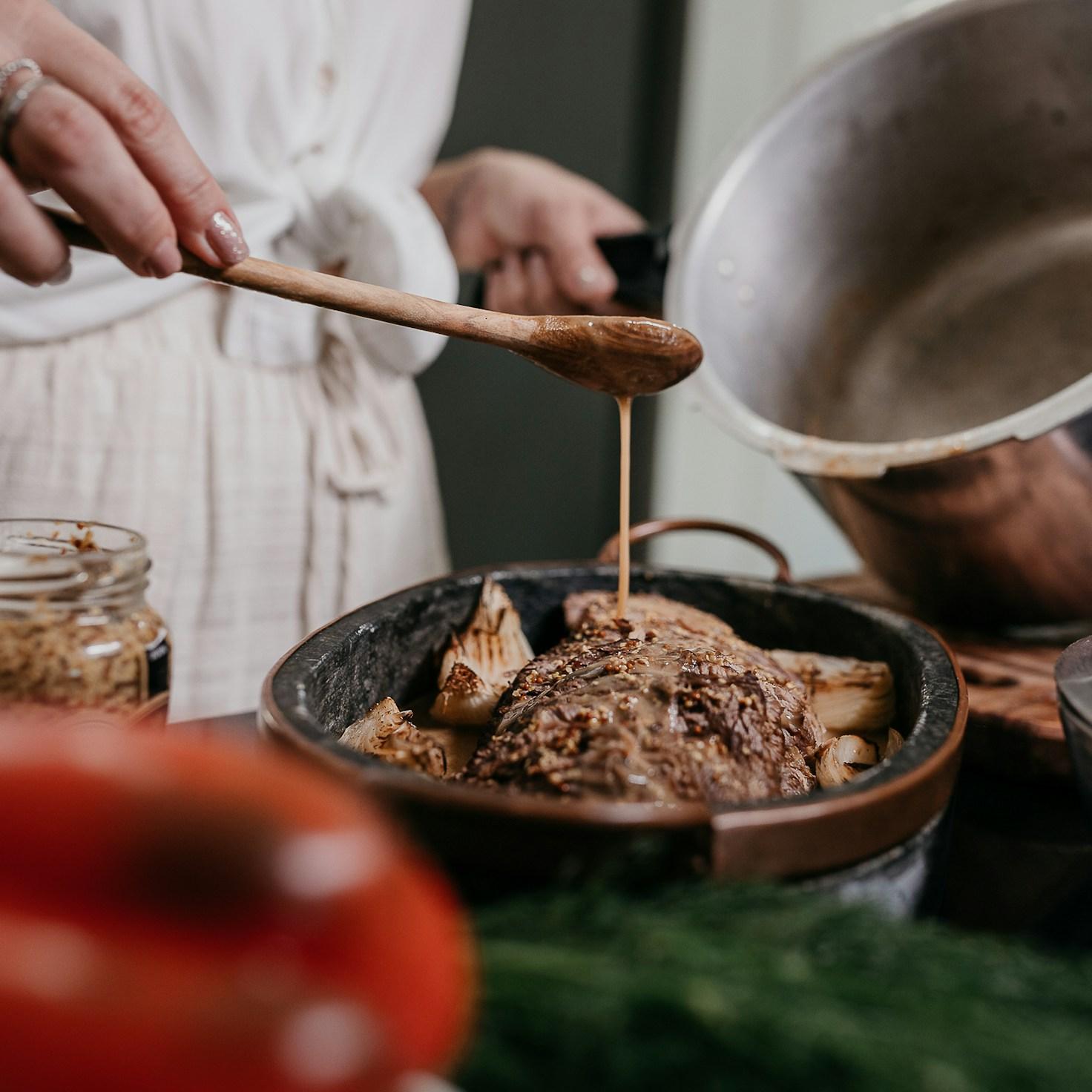 Community members collaborating in a modern kitchen space, sharing recipes and cooking techniques
